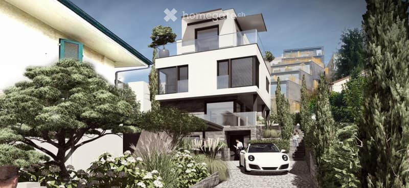 Modern two-story building with white facade, large windows, and a balcony on the upper level. A white sports car is parked in front of the garage entrance, surrounded by greenery and trees.