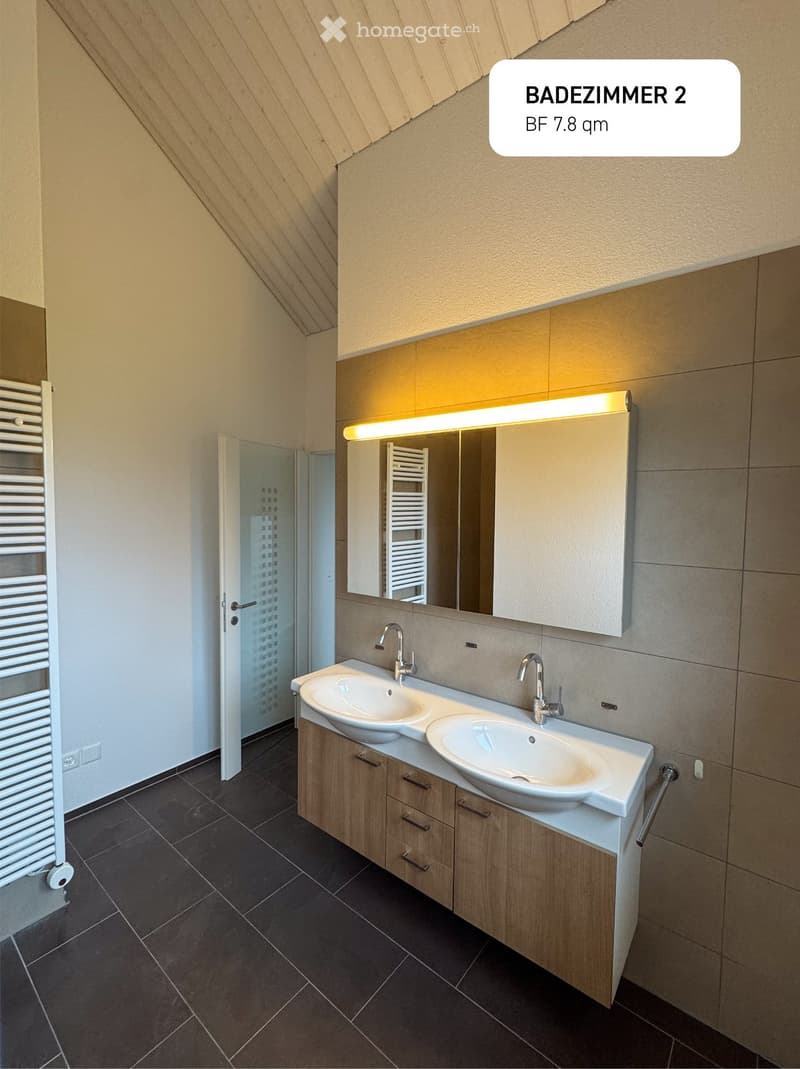 bathroom with two sinks, mirror, wooden cabinet, radiator, tiled floor