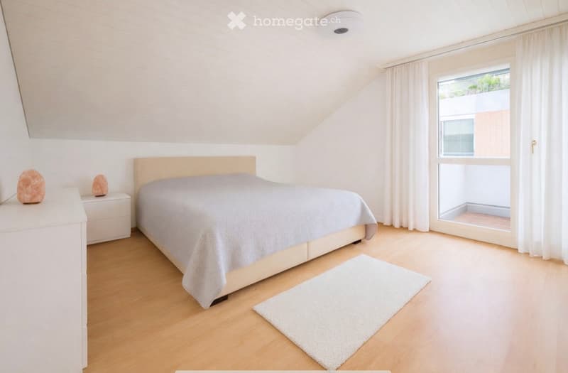 wooden floor, white ceiling, white wall, double bed, rug, white nightstands, large glass door, balcony