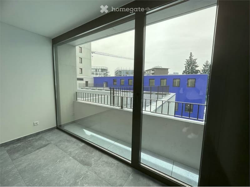 Sliding glass door, concrete flooring, balcony, metal railing, outside view