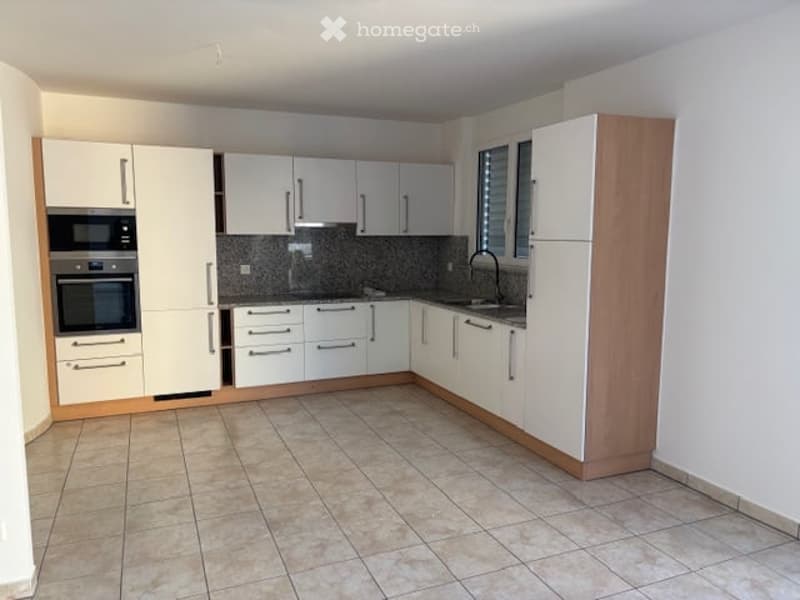 modern kitchen with white cabinets, tiled floor, built-in oven and dishwasher, sink with faucet
