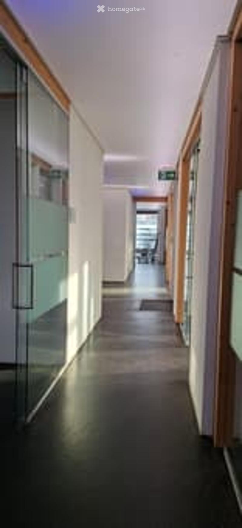 glass doors, wood paneling, tile floor
