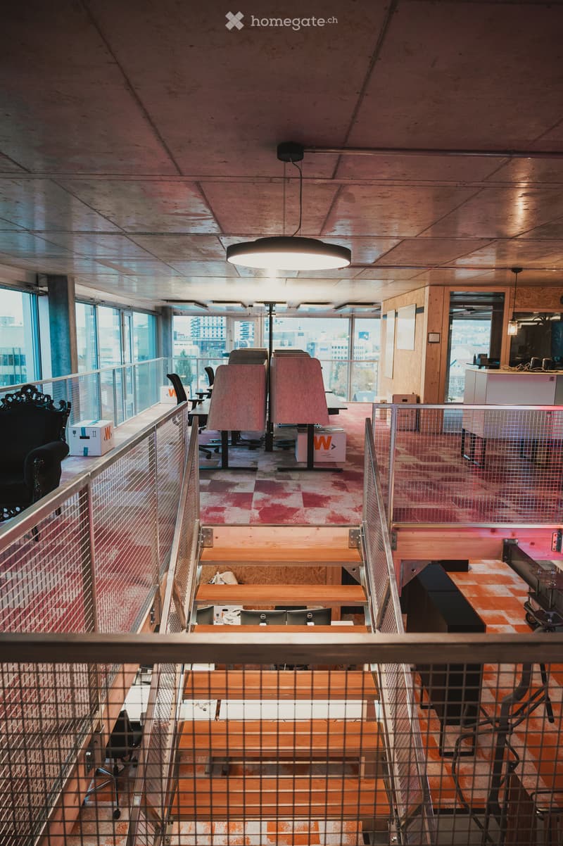 modern office design, industrial ceiling, large windows, wooden stairs, workstations, office chairs, storage boxes, railings