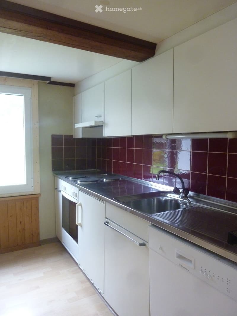 kitchen area with white cabinetry, tiled backsplash, sink, gas stove, dishwasher, and microwave