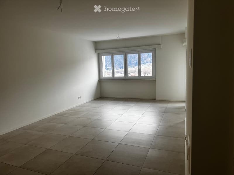empty room, large window, tile flooring, white walls