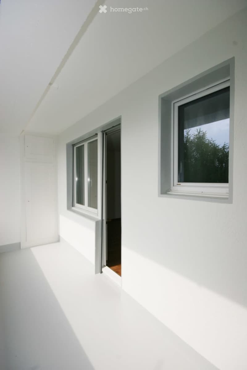 empty room, white walls, white floor, 2 windows, open sliding door
