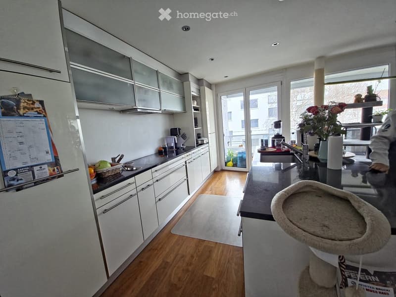 modern kitchen, granite countertops, white cabinets, wooden floors, dishwasher, refrigerator, window with view