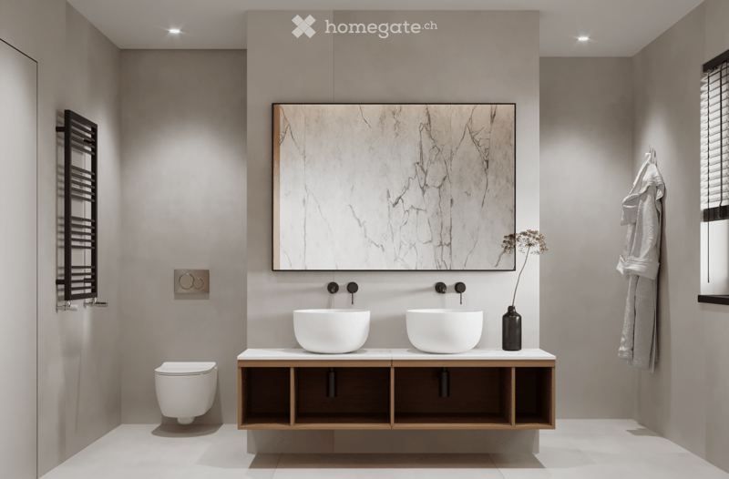 Modern bathroom with a double sink, marble countertop, wall-mounted toilet, under-sink cabinet, and a large mirror with a golden frame.