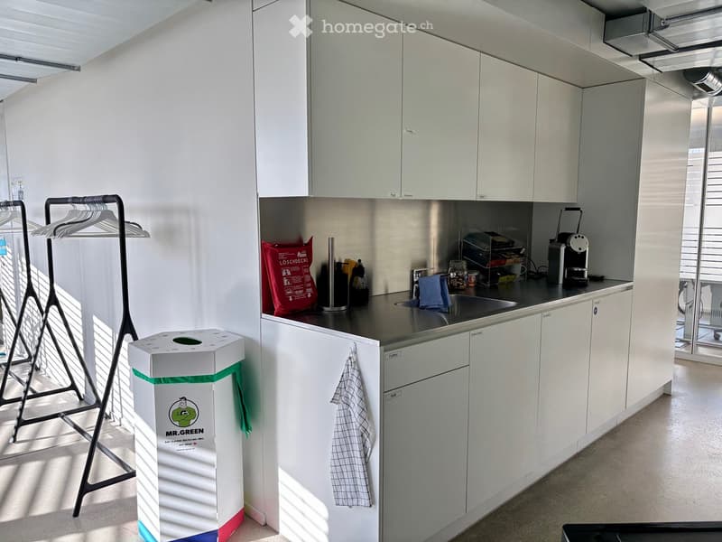 white cabinets, stainless steel counter, sink, appliances, white floor