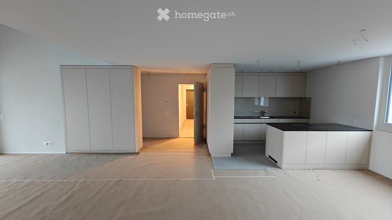 kitchen with open-plan layout, cabinets, island countertop, sink, faucet, large empty room, white walls, doors