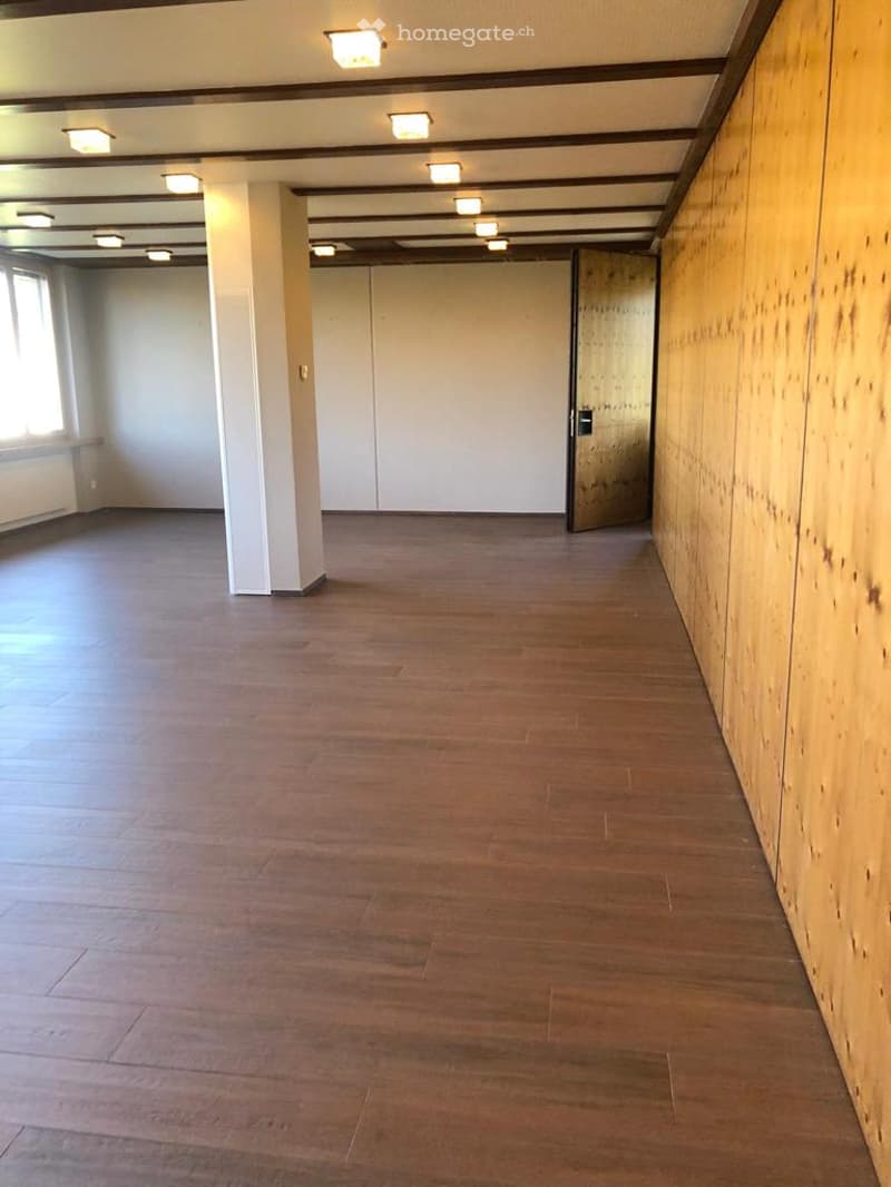 empty room, wooden floors, wooden wall, open door, ceiling lights