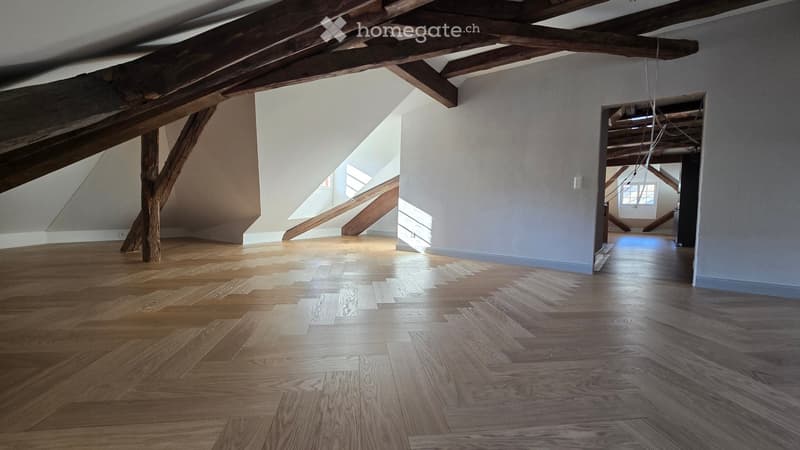 wooden beams, wooden floor, white walls, windows