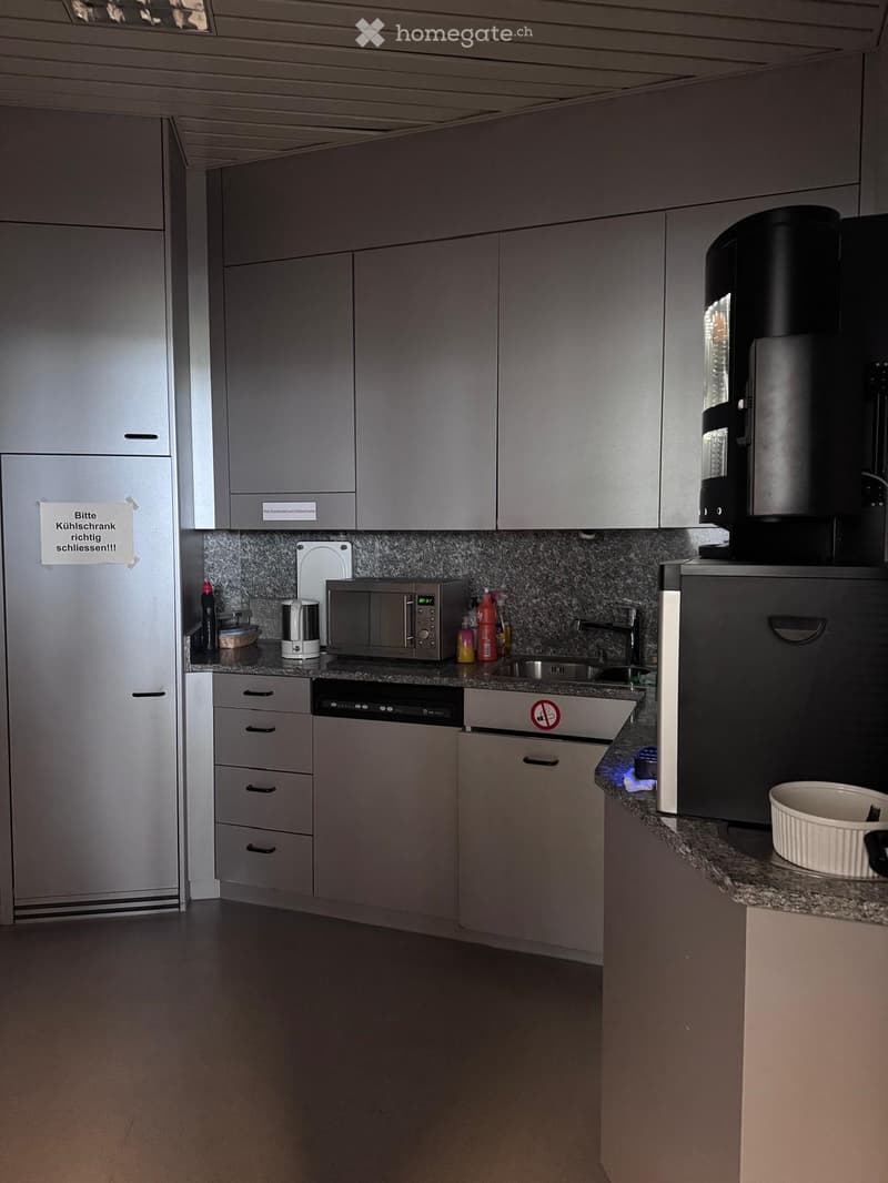 kitchen appliances, granite countertop, microwave, sink, cabinets, dishwasher