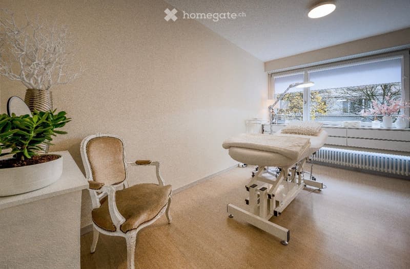 Room with bed, chair, plants, desk, lamp, radiator, windows