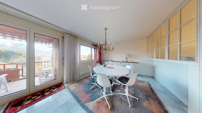 White table and chairs, Chandelier, Carpet, Double doors, Glass balcony