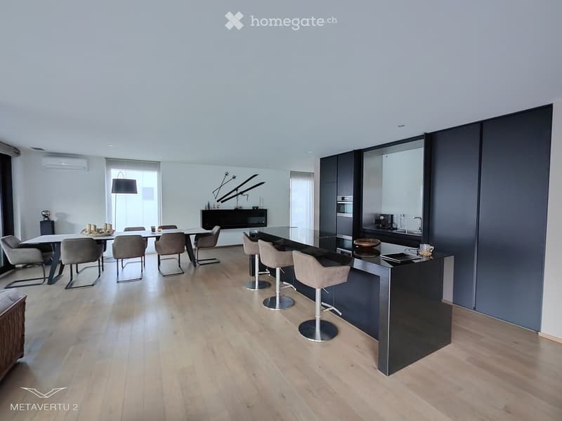 modern kitchen with dining area, wooden floor, black countertops, central island, white walls, full height cabinets