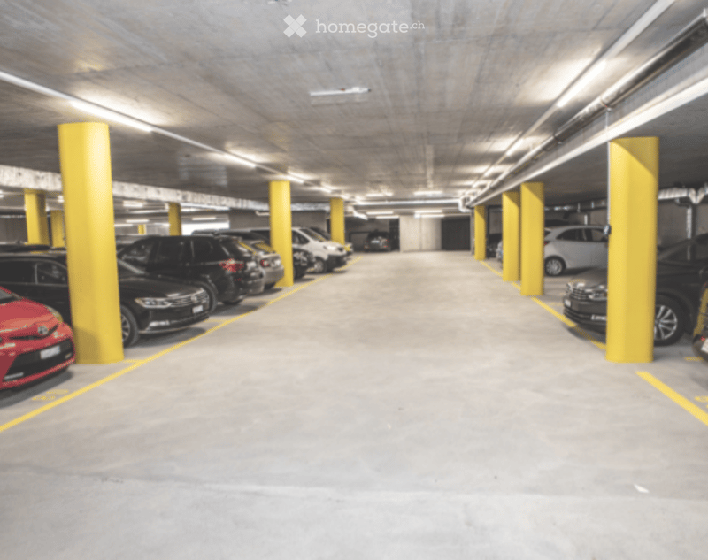 Subground parking lot with yellow columns and yellow parking lines