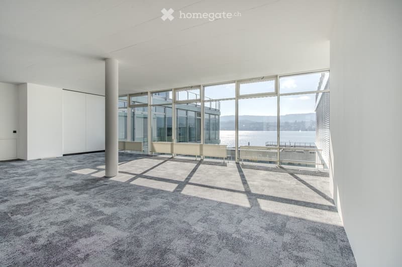 empty room, large windows, balcony, gray carpet, white walls, white ceiling