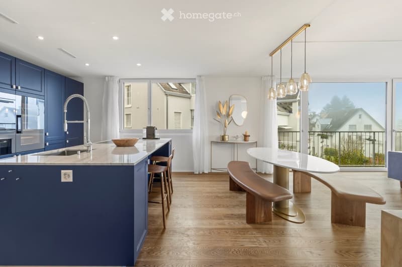 Open kitchen, blue cupboards, marble countertop, modern island, large windows, wooden floor