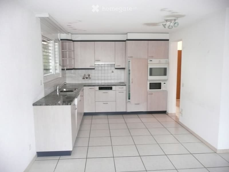 white tiled floor, white countertops, white cabinets, sink, dishwasher, microwave