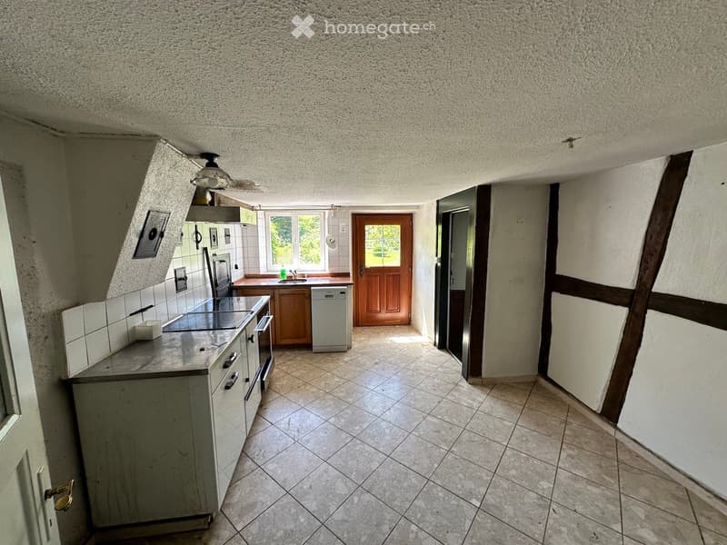 white tiled walls, white tiled floor, wooden cabinets, white countertop, dishwasher, stove