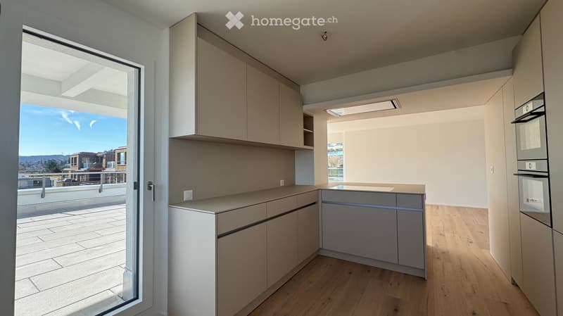 Modern kitchen, island, under cabinet lighting, balcony with railing, glass door to balcony