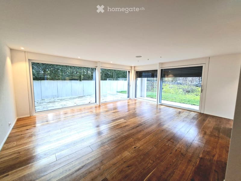 empty room, hardwood floors, large glass windows, white walls