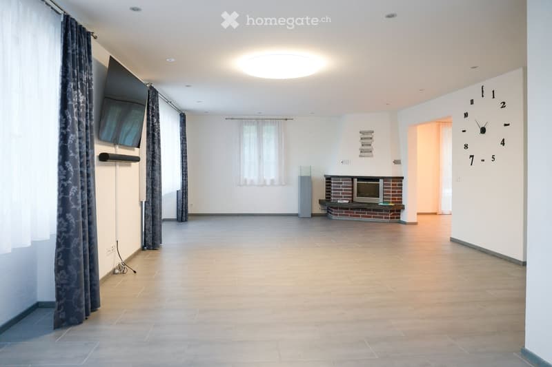 empty room, fireplace, mounted TV, ceiling light, white walls, tiled floor