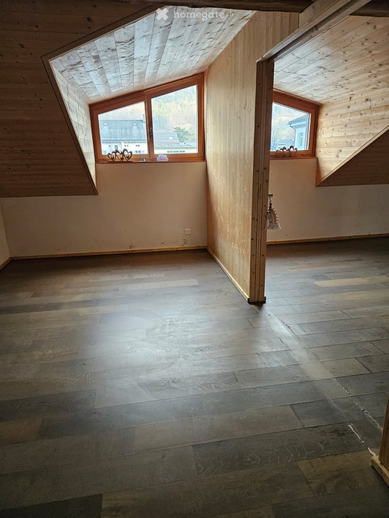 empty room, wooden floor, wooden ceiling, two windows