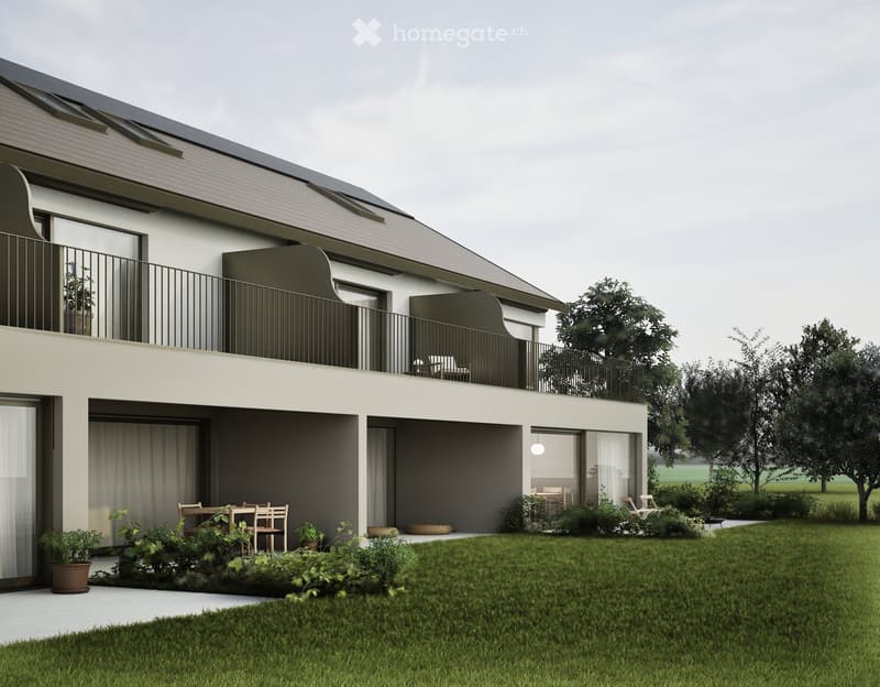 Modern two-story house with solar panels on the roof, balconies, and a garden