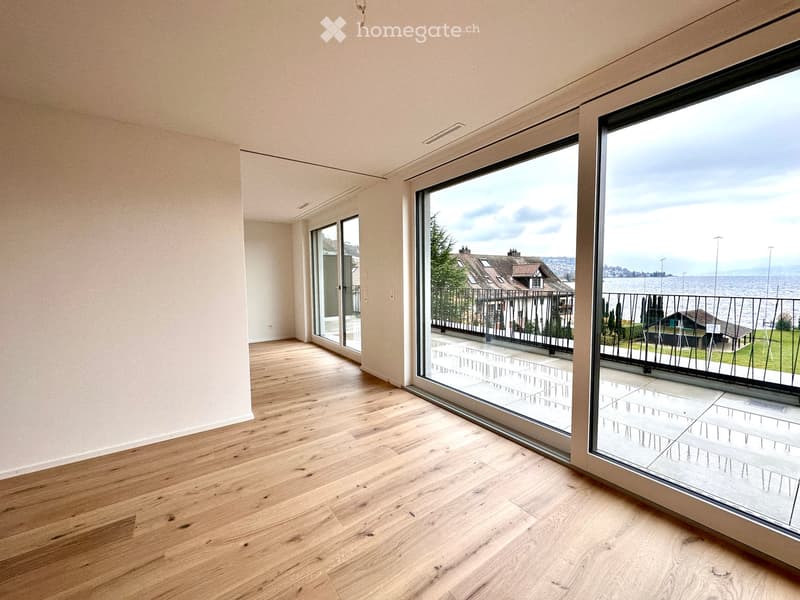 empty room, wooden floor, sliding glass doors, balcony, view of the sea