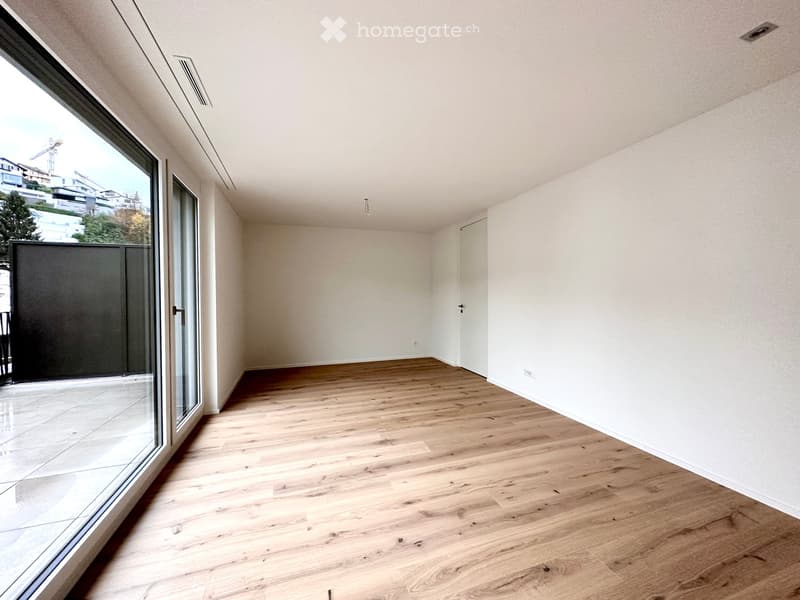 empty room, wooden floor, white walls, sliding glass doors, balcony