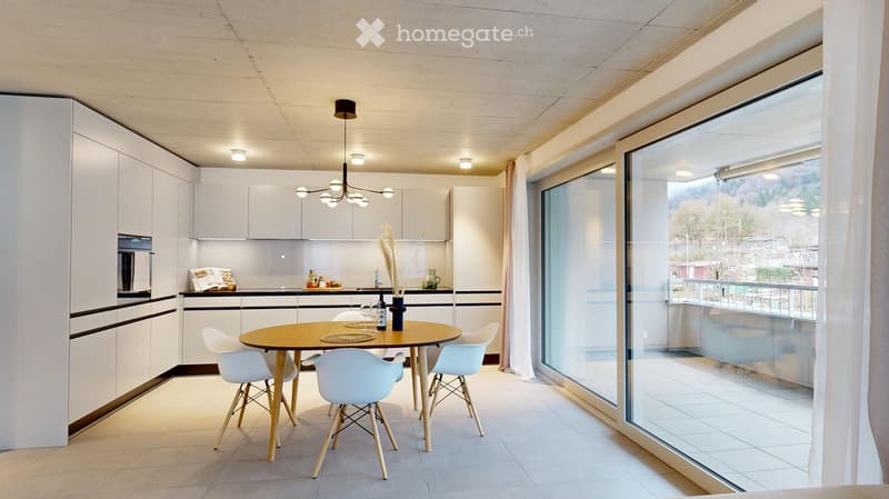 modern kitchen with wooden table, white chairs, white cupboards, white tiled floor, chandelier, sliding doors leading to balcony