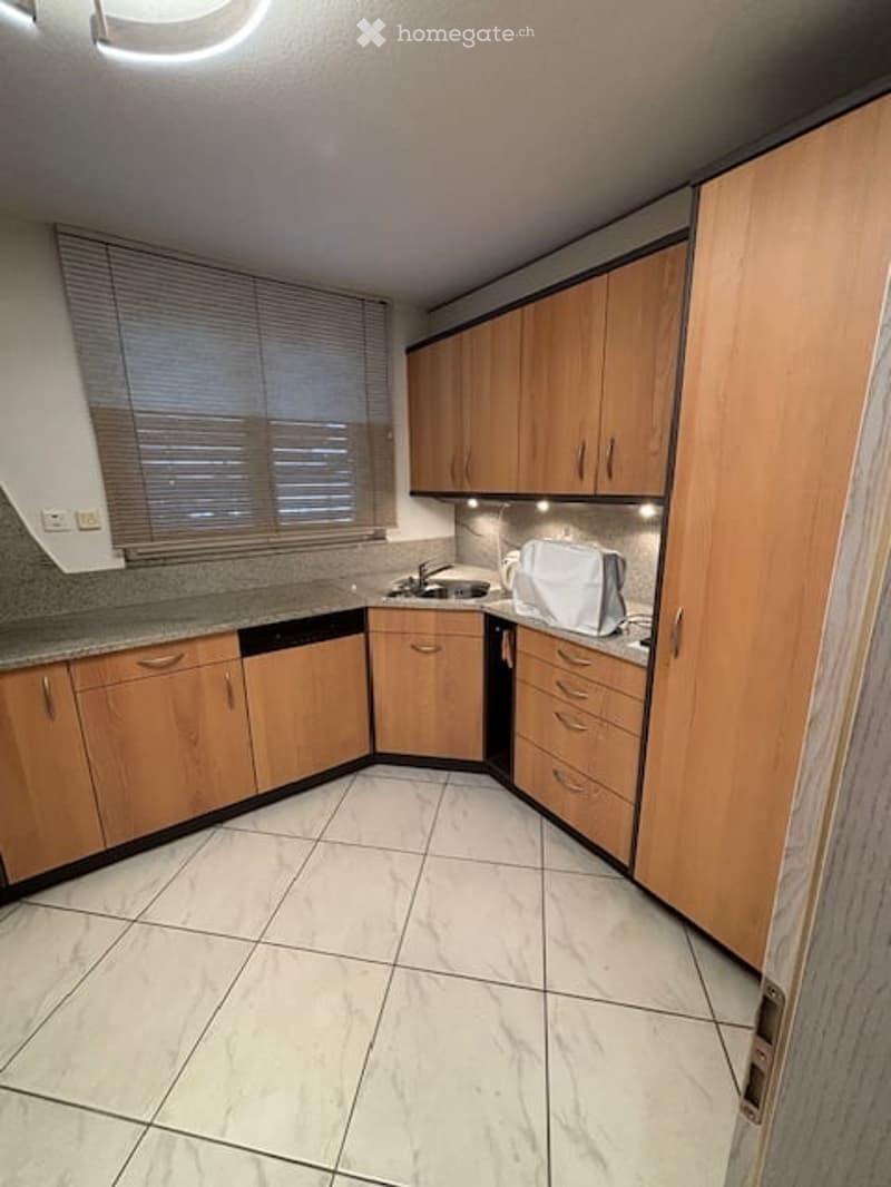 kitchen with white tile floor, wooden cabinets, granite countertop, stainless steel sink and faucet, dishwasher, and white appliances