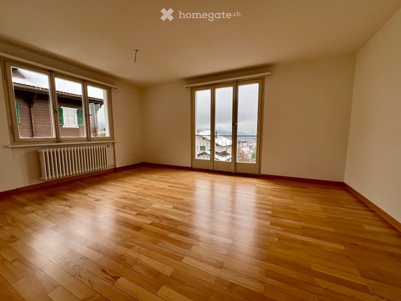 large windows, balcony, wooden floor, empty room