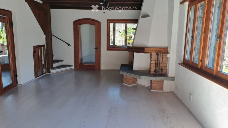 empty room, fireplace, wooden floor, white walls, windows, doors