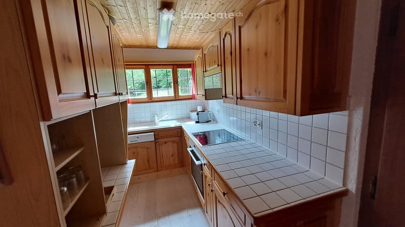 wooden cabinets, white tiles, sink, dishwasher, oven, wooden ceiling