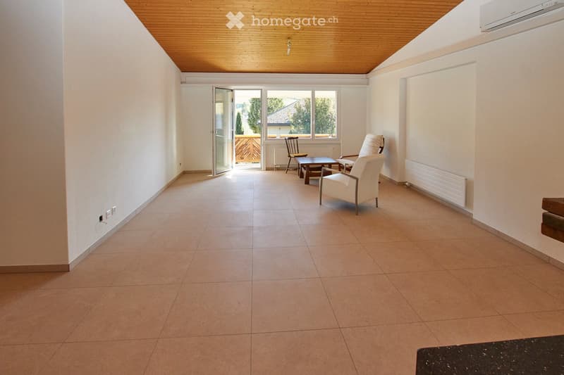 tiled floor, wooden ceiling, white walls, open balcony with railings, two chairs, one with cushions, a wooden table, air conditioning and heating systems, electrical outlets