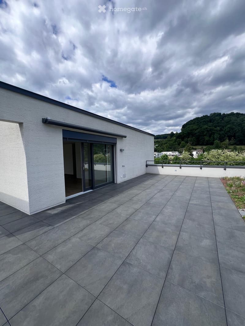 modern design with grey tiling, metal railings, sliding glass doors