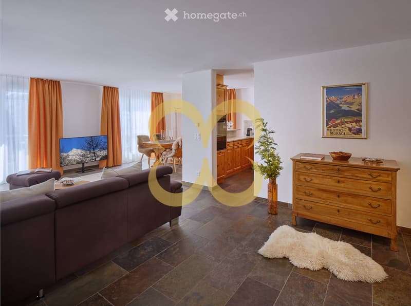 modern living room, L-shaped sofa, dining table, coffee table, TV, kitchen area with wooden cabinets