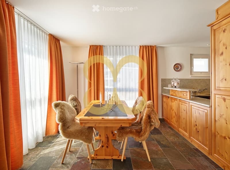 open dining area, wooden dining table, wooden chairs, wooden cabinetry, granite flooring, orange curtains