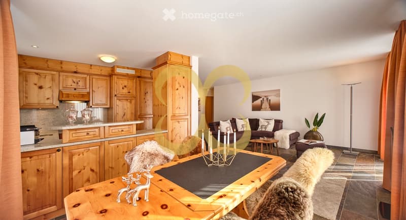 wooden dining table with candles, fur rugs, wooden cupboards, wooden dining chairs, central heating radiators, kitchen