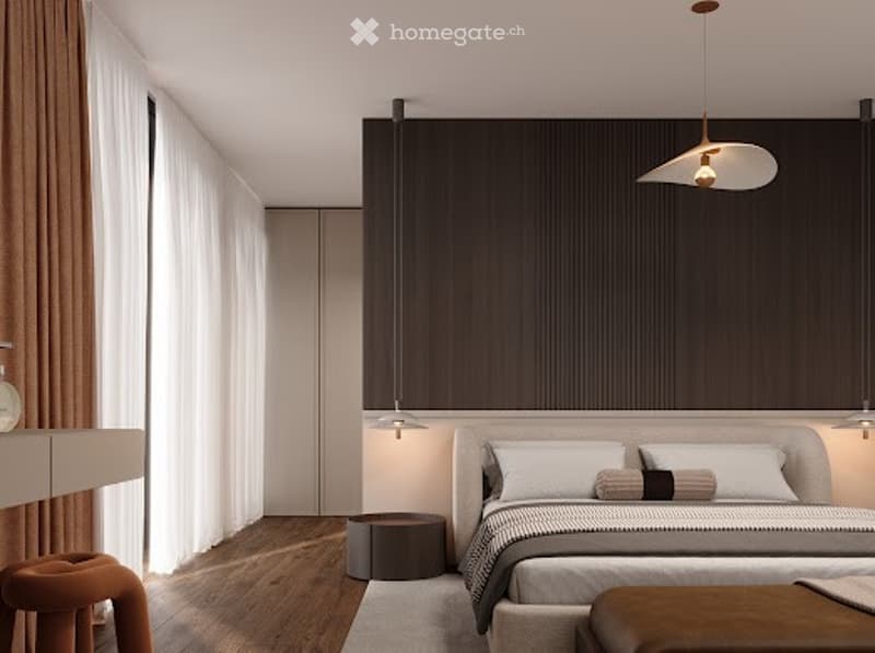 Bedroom with wooden floor, white ceiling, grey bed, pendant lights, brown curtains, small wooden stool, and small round brown table.