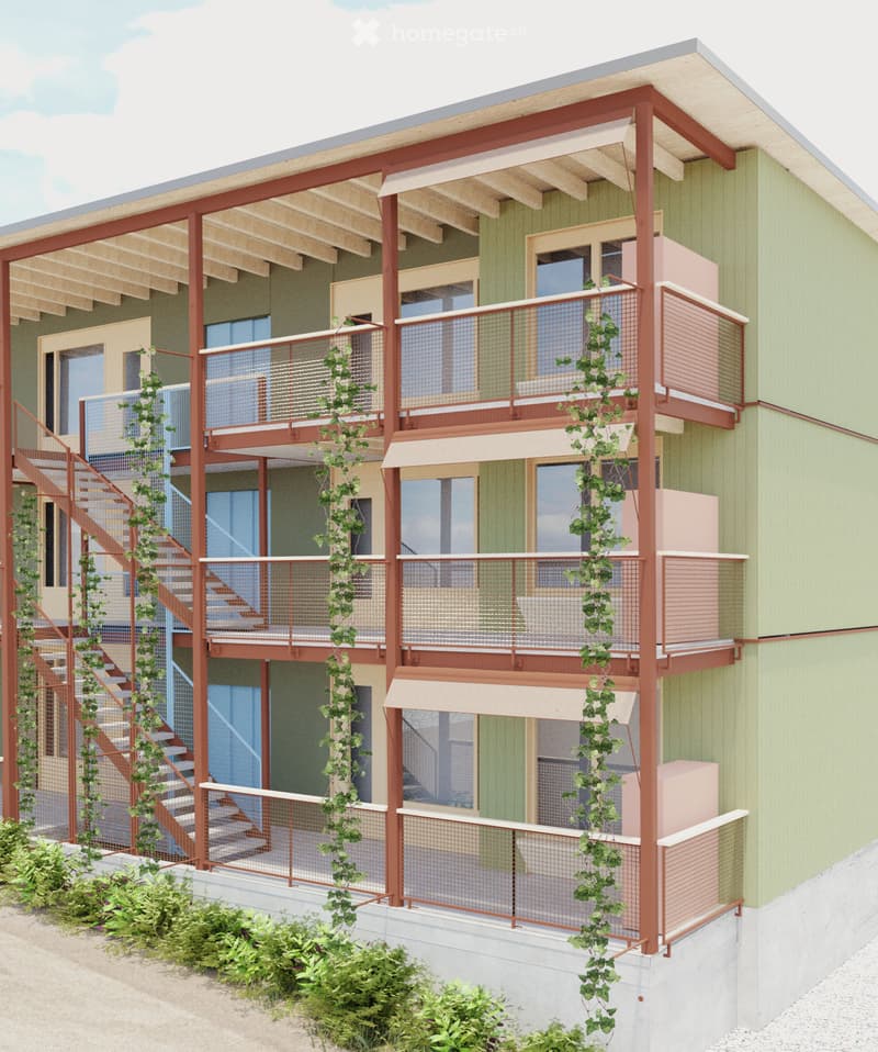 3 story building, green exterior, balconies with railings, stairs connecting floors