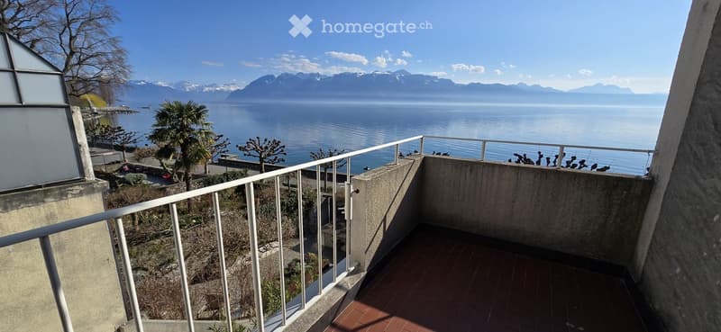 balcony, overlooking lake and mountains, trees, plants