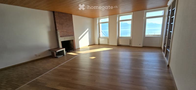 wood floor, fireplace, large windows, balcony