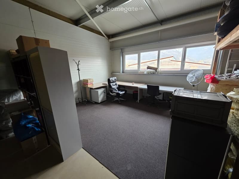 empty room, desks, chairs, storage boxes, white walls, windows