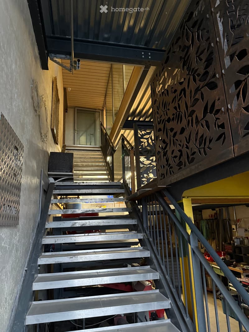 Metal staircase leading to an elevated floor
