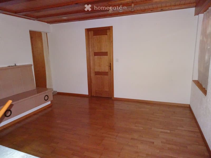empty room, wooden floor, white walls, wooden doors, ceiling lamps, window with curtain
