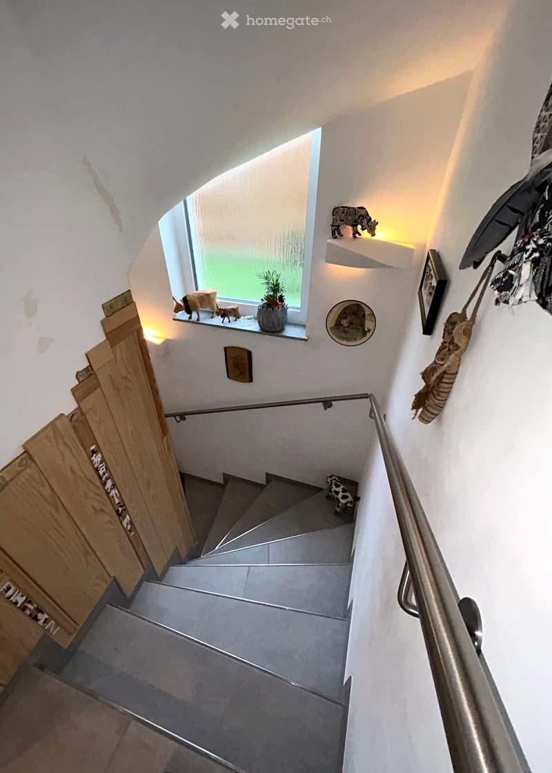 stone steps, wooden panels, silver handrail, window, objects